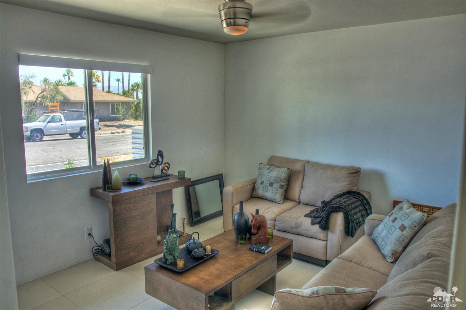 465 East Simms Road Palm Springs, CA 92262 - Photo 22 of 41 a living room with furniture and a window