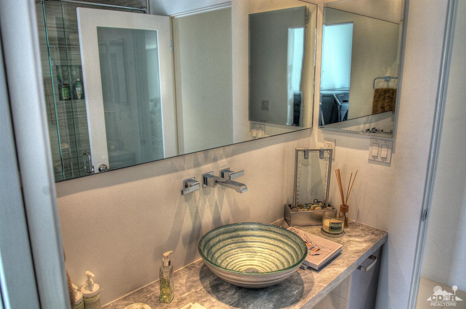 465 East Simms Road Palm Springs, CA 92262 - Photo 25 of 41 a bathroom with a granite countertop sink and a mirror