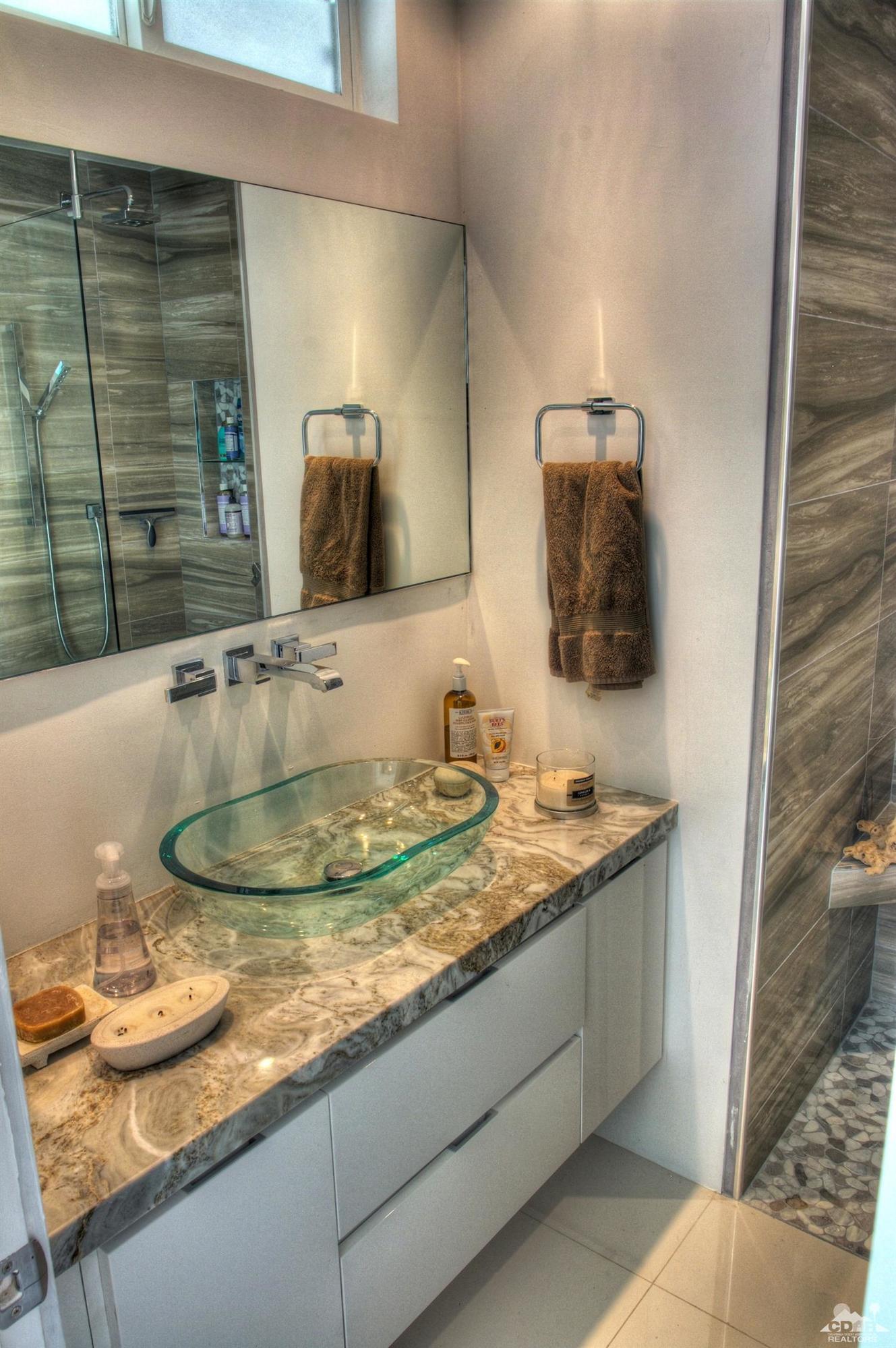 465 East Simms Road Palm Springs, CA 92262 - Photo 27 of 41 a bathroom with a granite countertop sink and a mirror