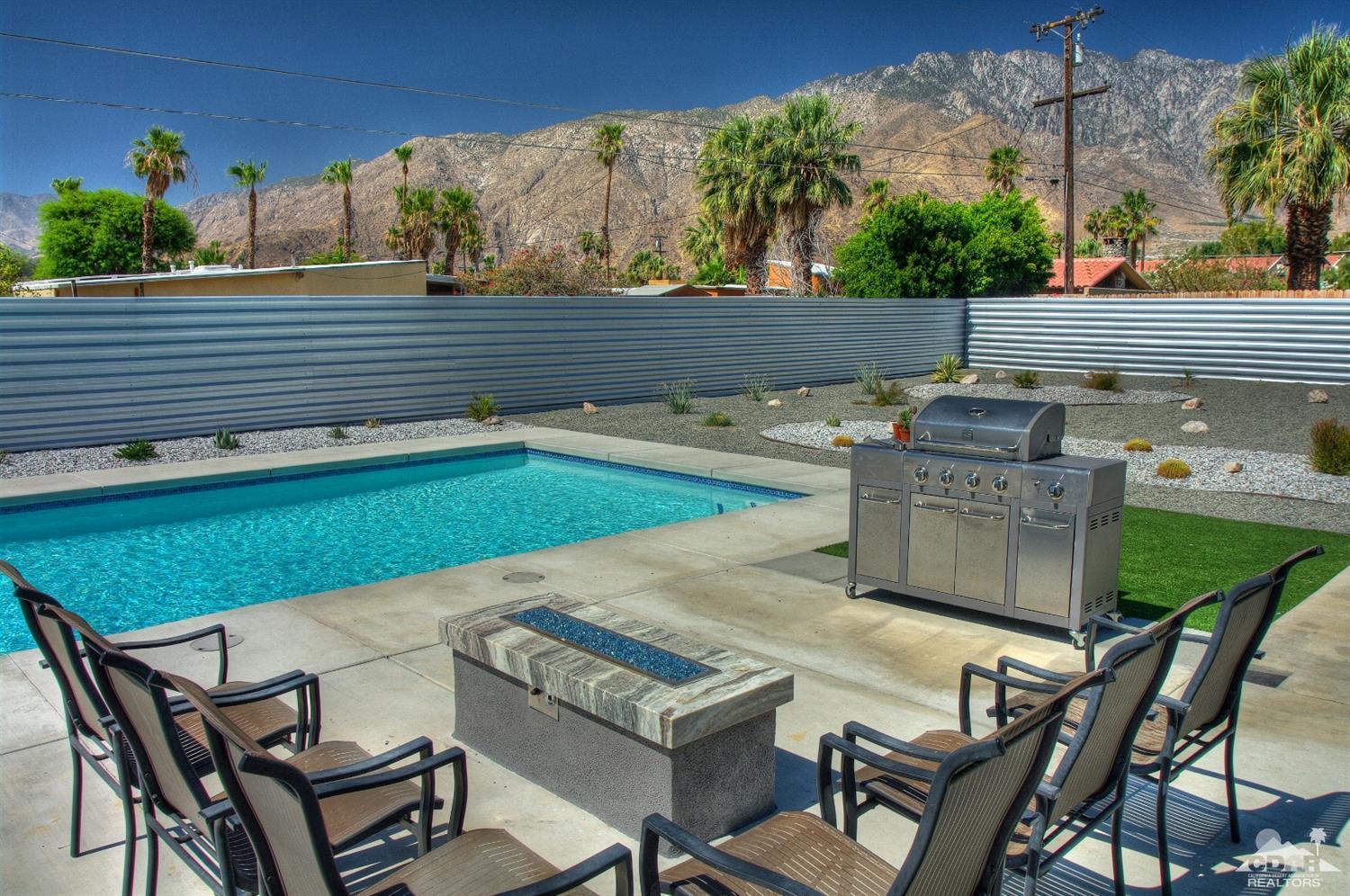 465 East Simms Road Palm Springs, CA 92262 - Photo 29 of 41 a view of a chairs and table in the terrace
