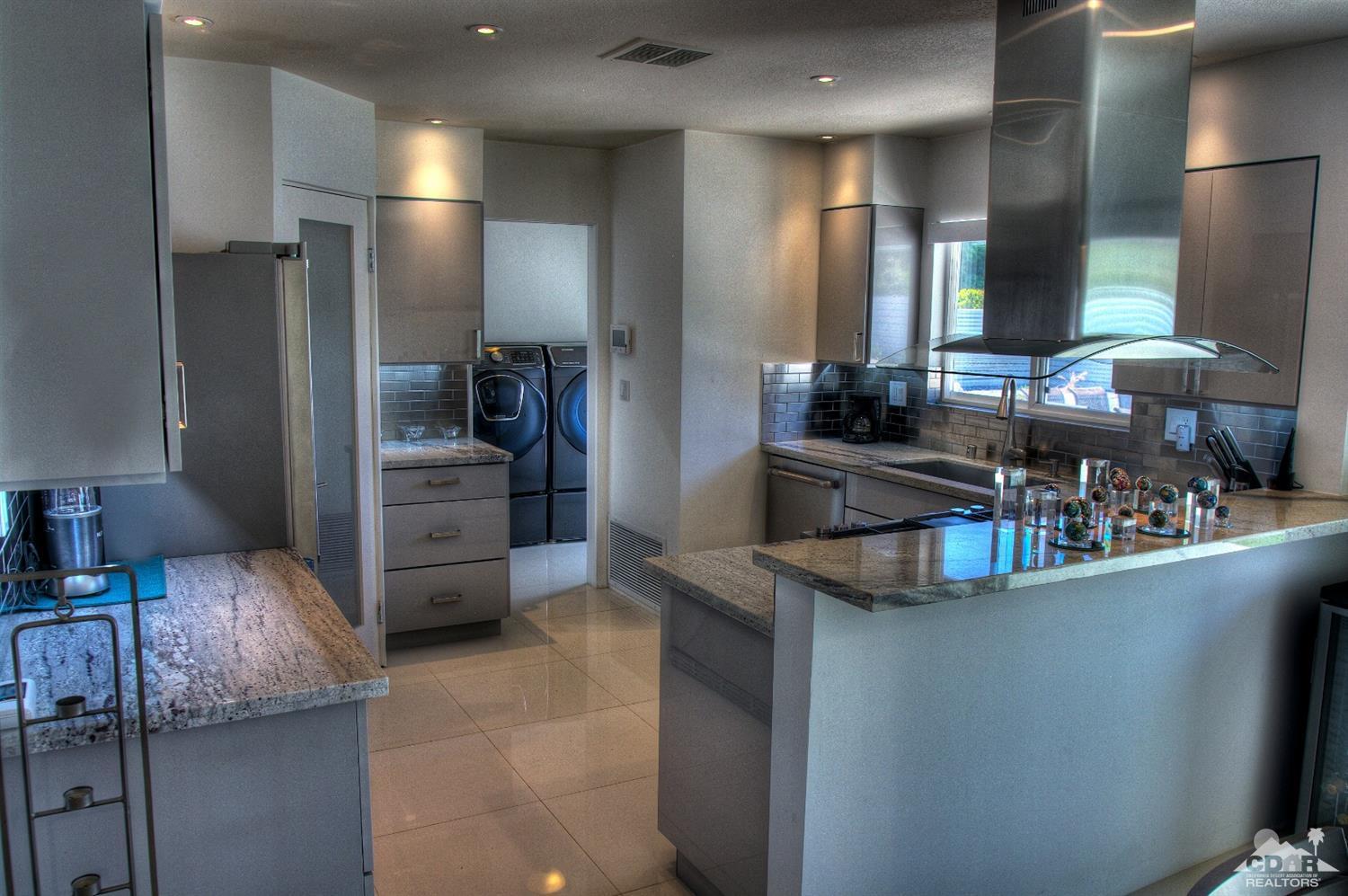 465 East Simms Road Palm Springs, CA 92262 - Photo 4 of 41 a kitchen with stainless steel appliances granite countertop a sink and a refrigerator