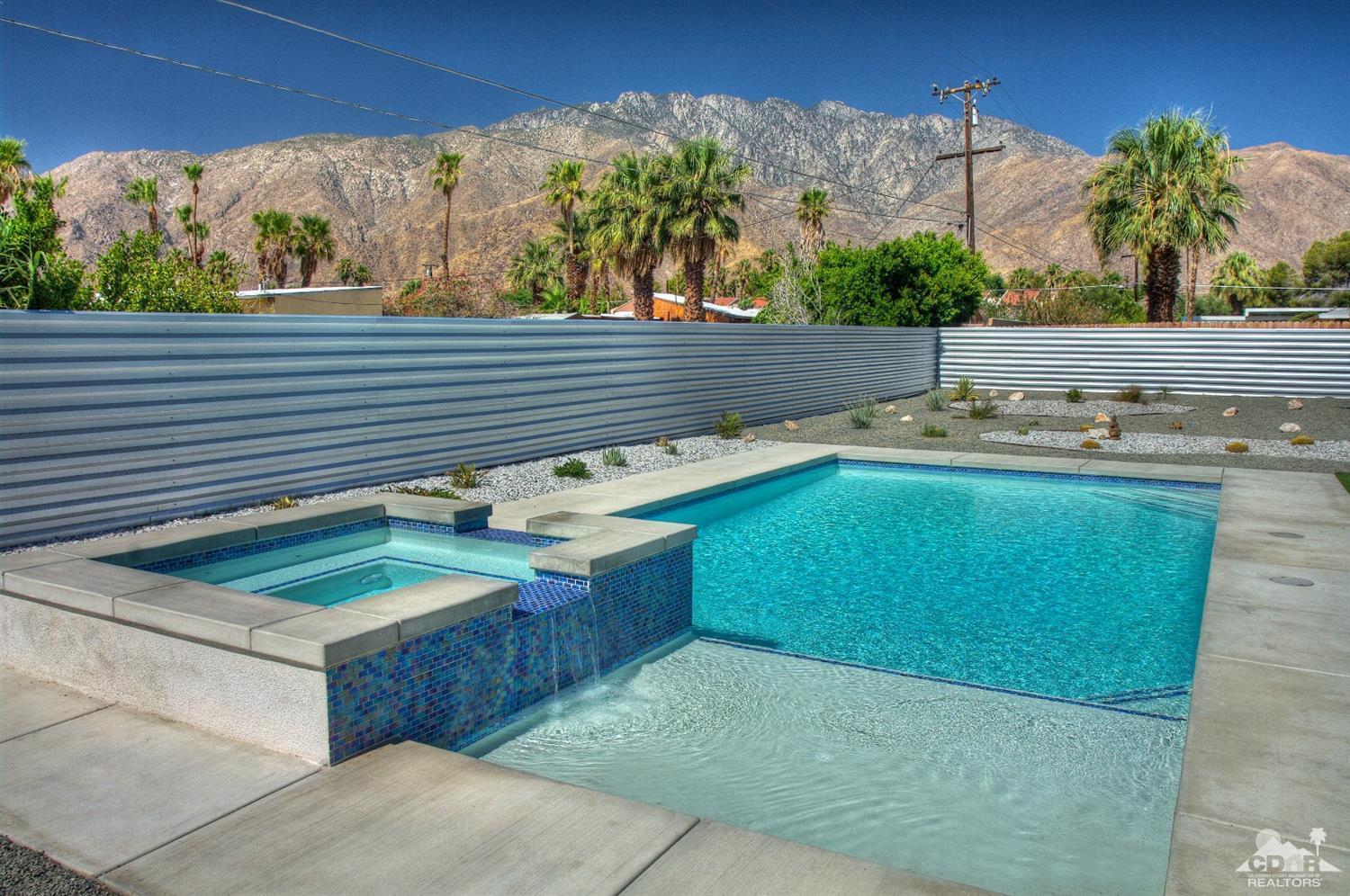 465 East Simms Road Palm Springs, CA 92262 - Photo 32 of 41 a view of a sink and table in a backyard