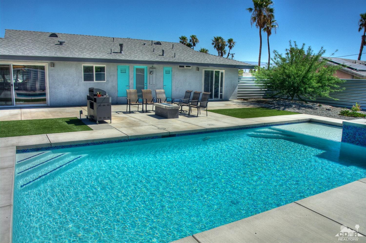 465 East Simms Road Palm Springs, CA 92262 - Photo 37 of 41 a view of a house with swimming pool yard and patio
