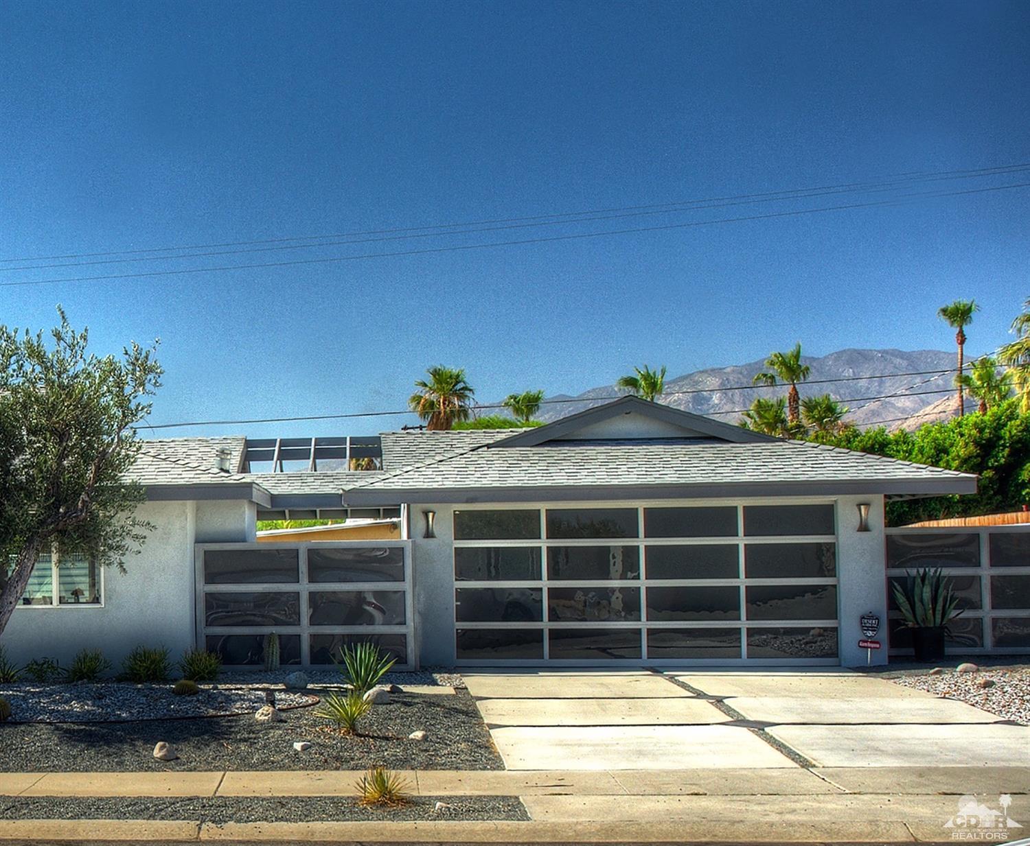 465 East Simms Road Palm Springs, CA 92262 - Photo 9 of 41 a view of a house with a patio and a yard