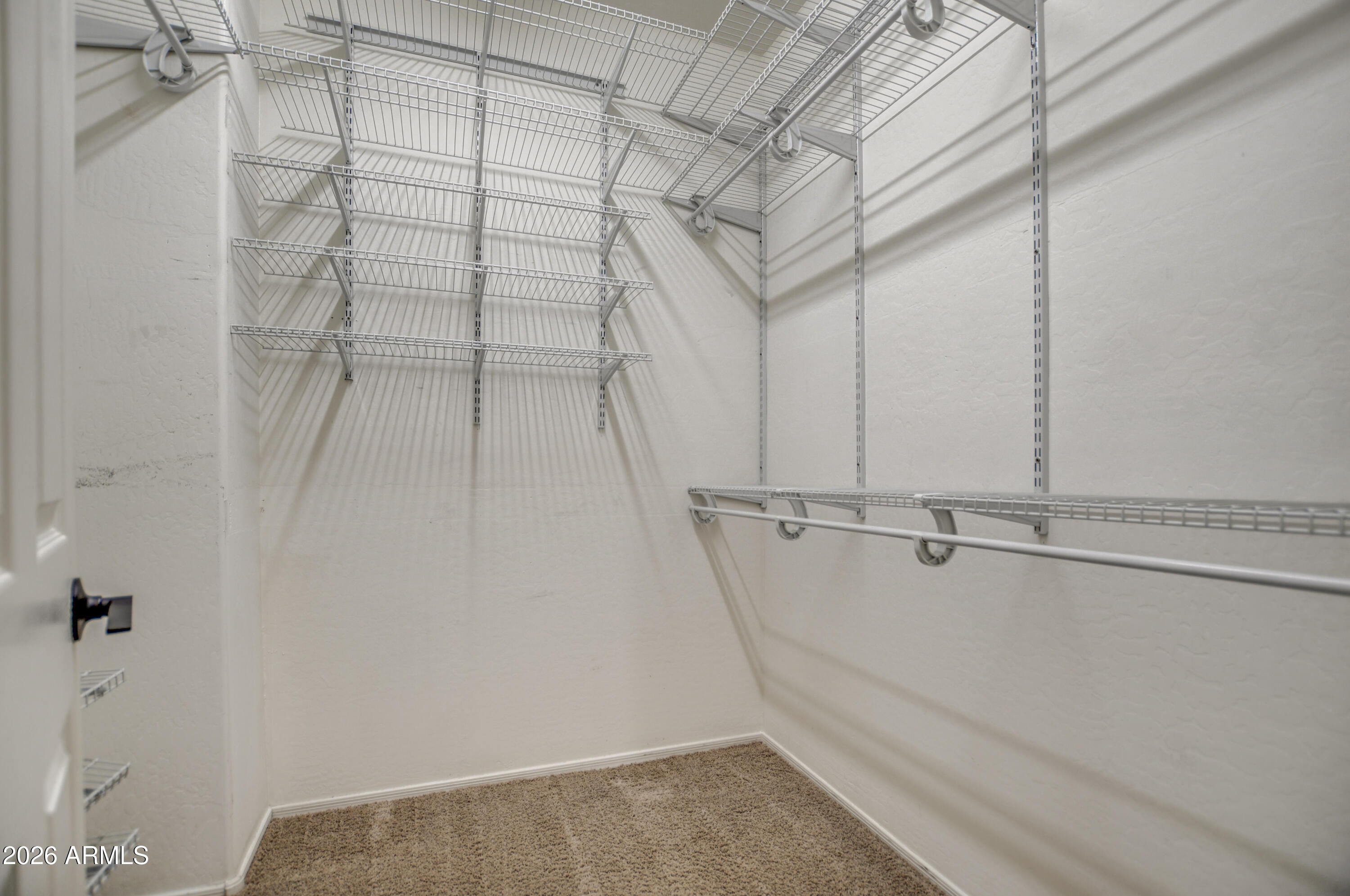 3078 East Muirfield Street Gilbert, AZ 85298 - Photo 65 of 92 a view of a room with racks on the wall