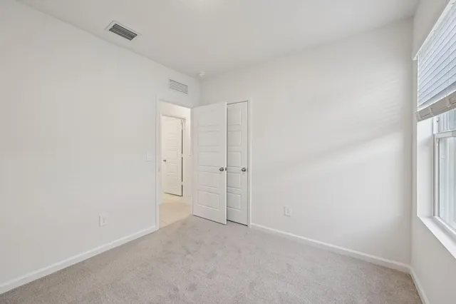a view of an empty room and window