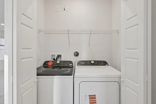 a utility room with dryer and washer