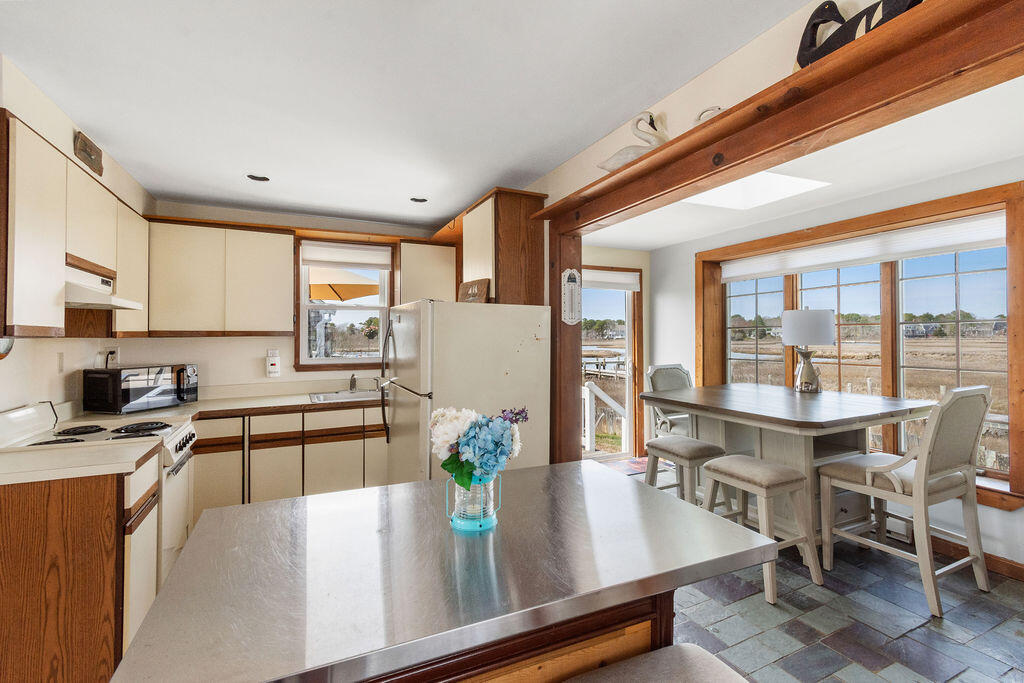 14 Lower County Road Dennis Port, MA 02639 - Photo 11 of 56 a kitchen with stainless steel appliances granite countertop counter space a sink and cabinets