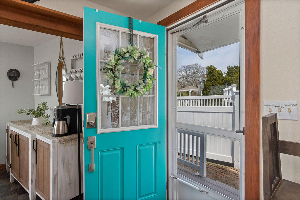 14 Lower County Road Dennis Port, MA 02639 - Photo 18 of 56 a view of a balcony door and furniture