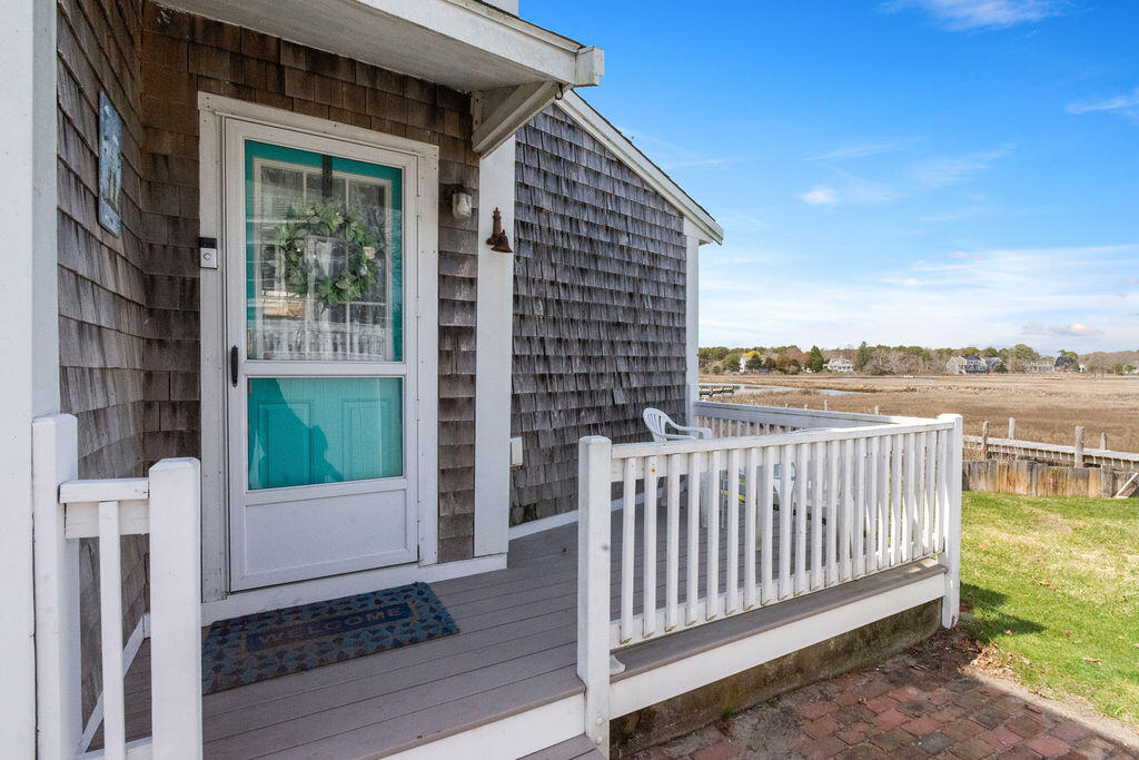 14 Lower County Road Dennis Port, MA 02639 - Photo 19 of 56 a view of a deck with wooden floor and fence