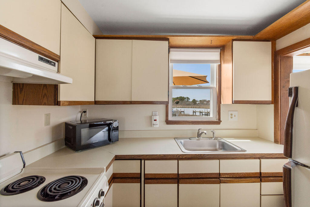 14 Lower County Road Dennis Port, MA 02639 - Photo 23 of 56 a bathroom with a bathtub and a sink