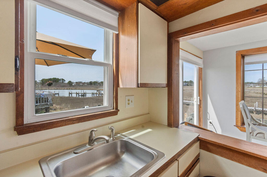 14 Lower County Road Dennis Port, MA 02639 - Photo 24 of 56 a bathroom with a sink and a window