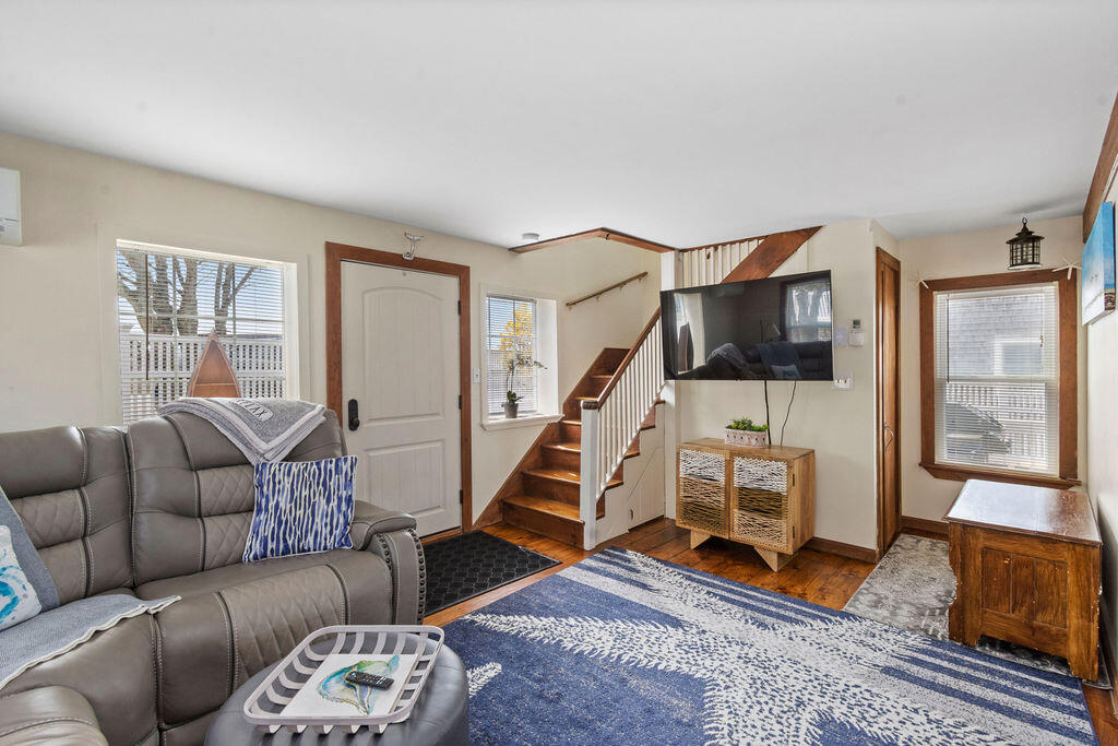 14 Lower County Road Dennis Port, MA 02639 - Photo 27 of 56 a bedroom with furniture and a wooden floor