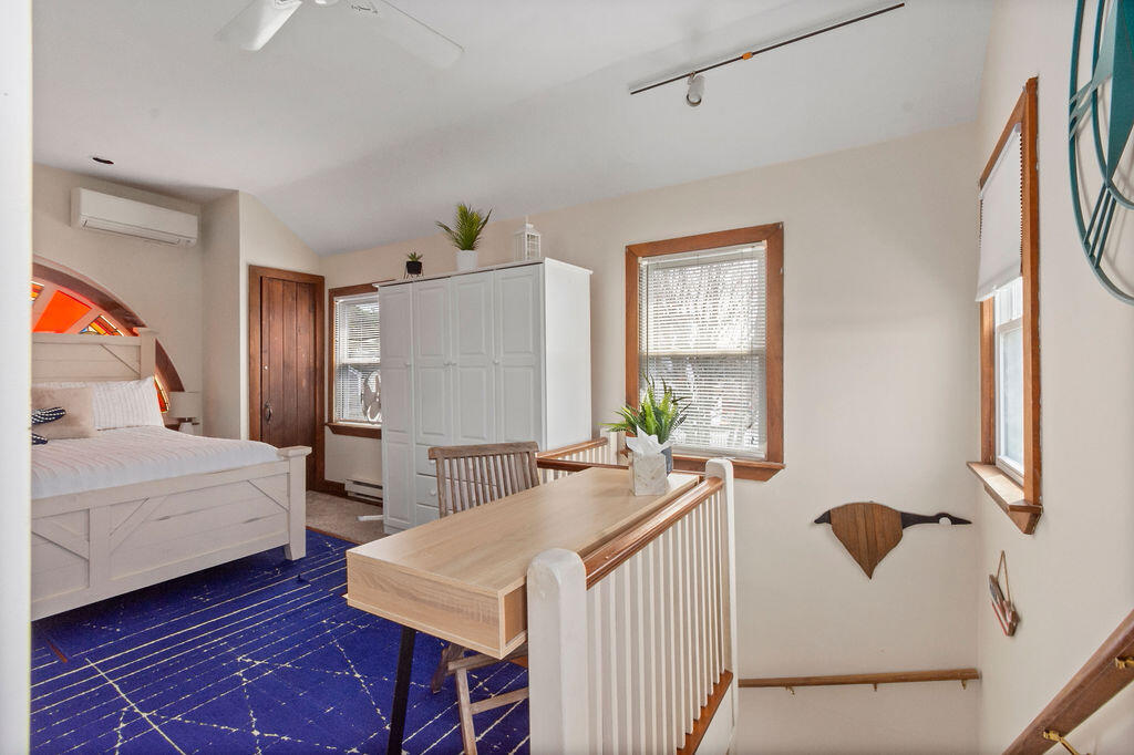 14 Lower County Road Dennis Port, MA 02639 - Photo 28 of 56 a bedroom with a bed and a table