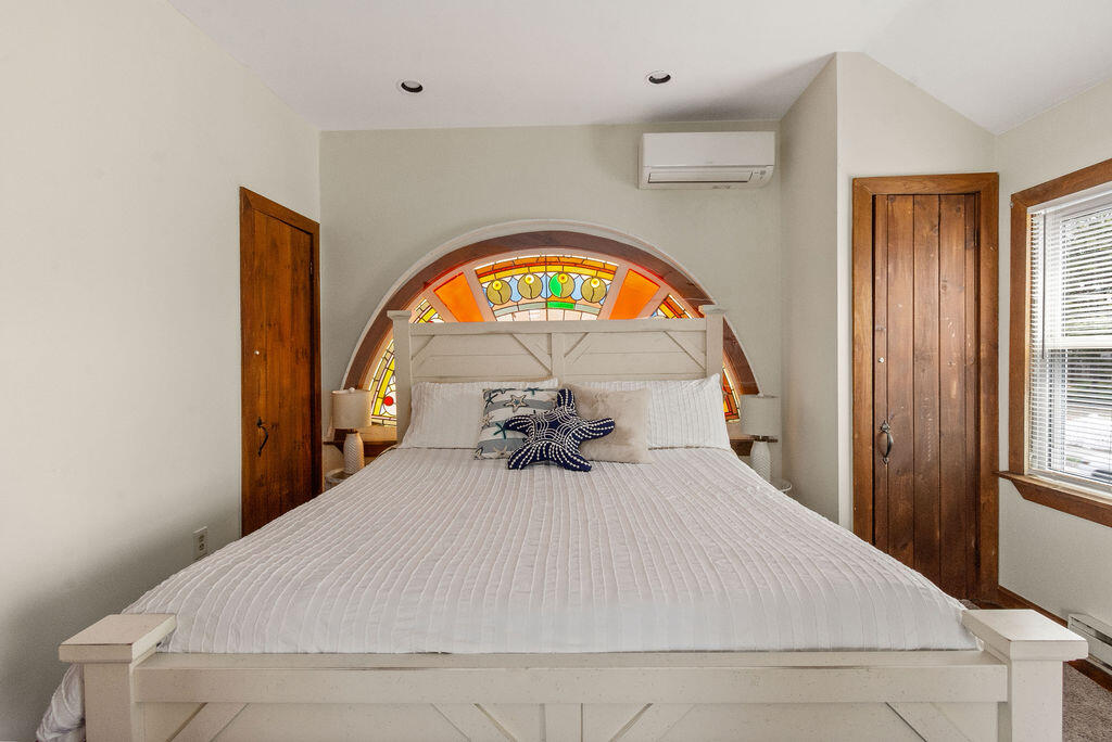 14 Lower County Road Dennis Port, MA 02639 - Photo 31 of 56 a bedroom with a bed and a large window