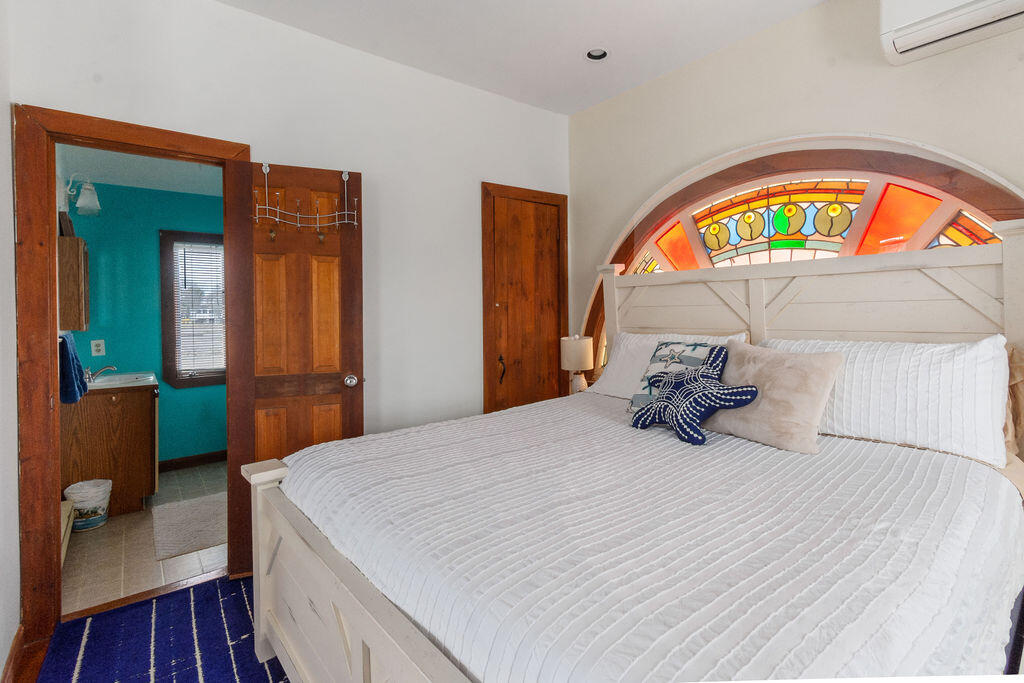 14 Lower County Road Dennis Port, MA 02639 - Photo 32 of 56 a bedroom with a bed and a television