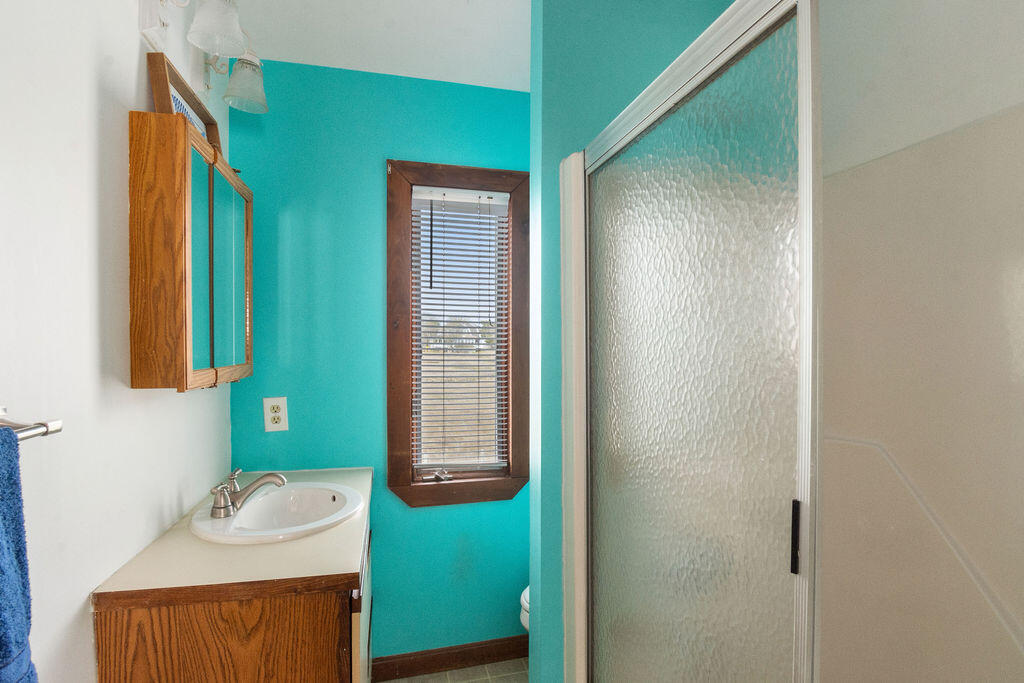 14 Lower County Road Dennis Port, MA 02639 - Photo 33 of 56 a bathroom with a sink and a mirror