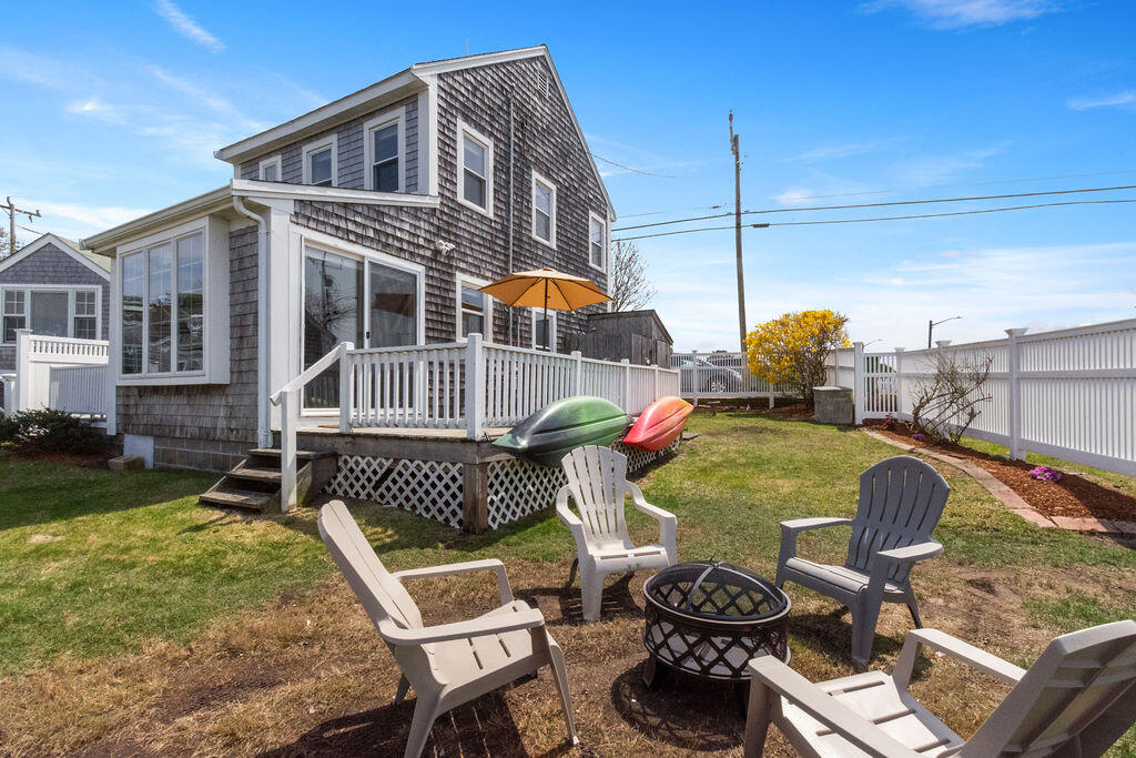 14 Lower County Road Dennis Port, MA 02639 - Photo 50 of 56 a view of a chair and tables in the patio