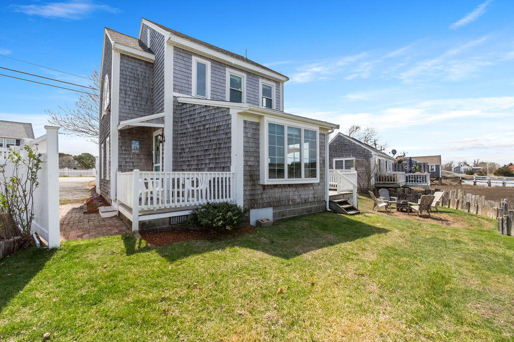 14 Lower County Road Dennis Port, MA 02639 - Photo 52 of 56 a view of a house with backyard and a tree