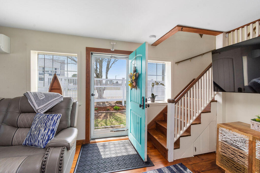 14 Lower County Road Dennis Port, MA 02639 - Photo 7 of 56 a living room with furniture and a rug