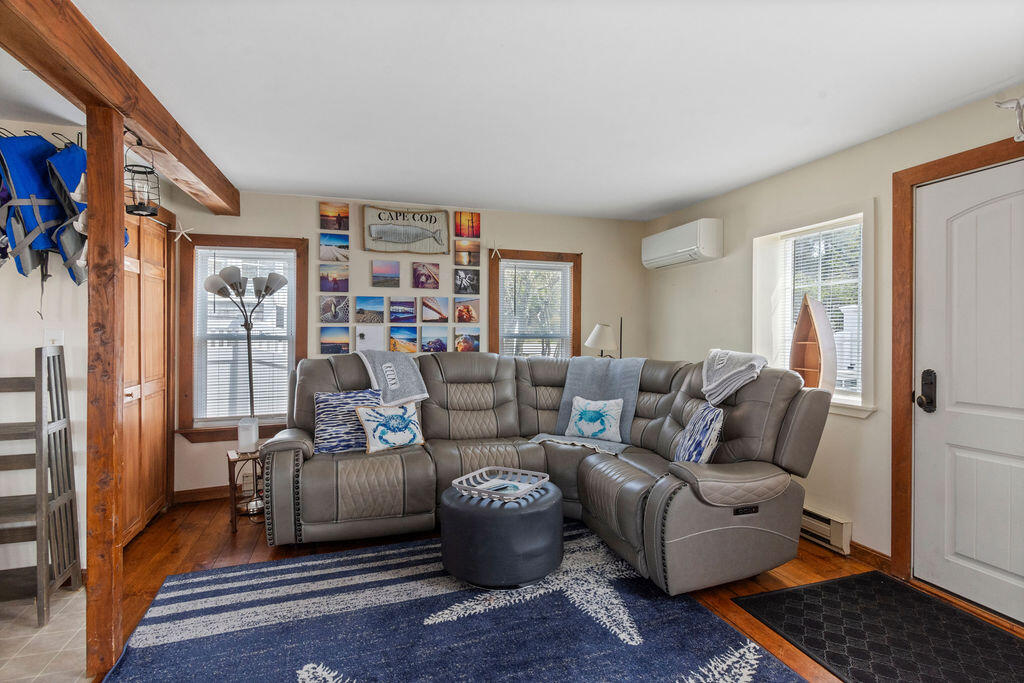 14 Lower County Road Dennis Port, MA 02639 - Photo 8 of 56 a living room with furniture and a rug