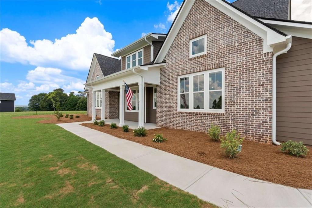591 Welcome Road Roopville, GA 30170 - Photo 6 of 60 a front view of a house with yard and green space