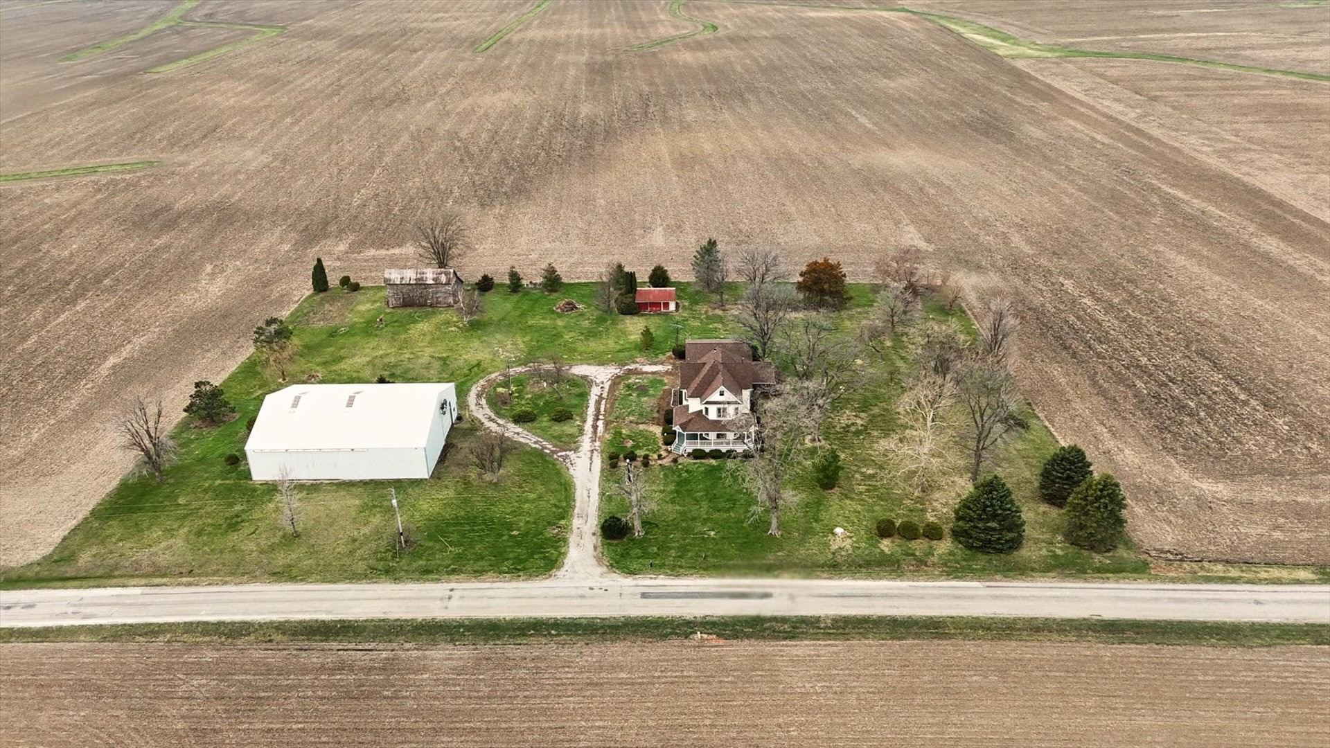 7961 North 3000 E Road Forrest, IL 61741 - Photo 2 of 66 a view of a street with houses