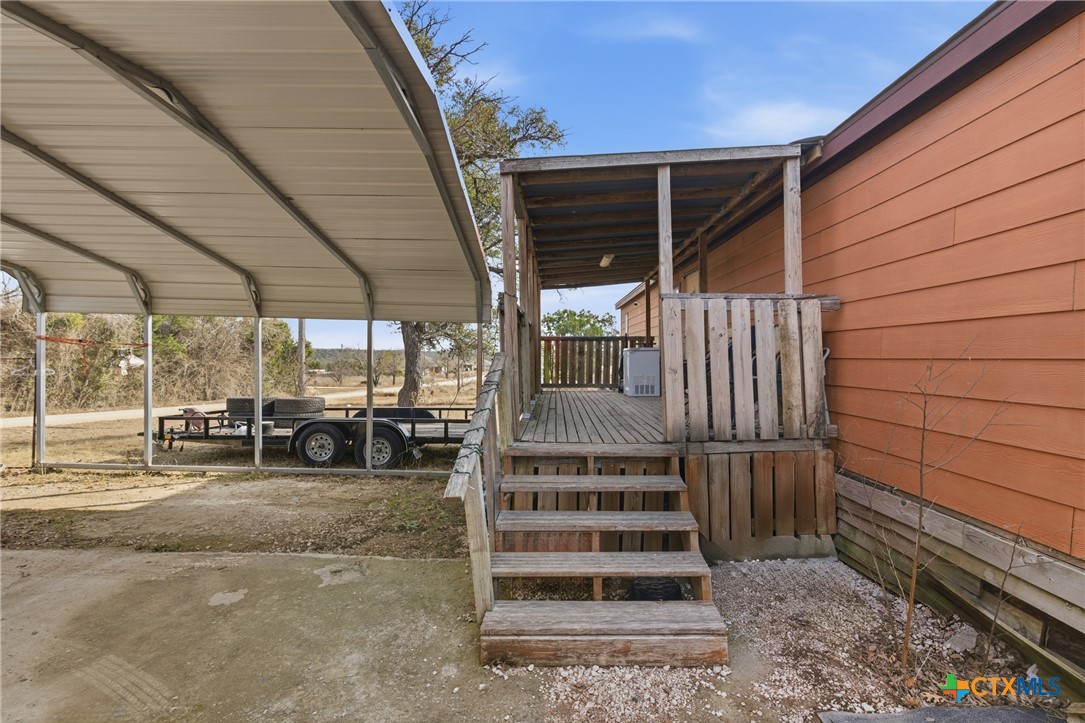 164 County Road 4450 Kempner, TX 76539 - Photo 19 of 42 a view of a porch with wooden walls and floor to ceiling window