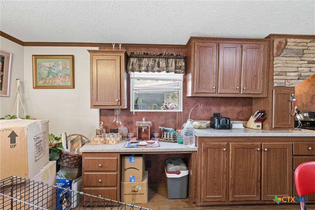 164 County Road 4450 Kempner, TX 76539 - Photo 23 of 42 a utility room with a sink a cabinets and window