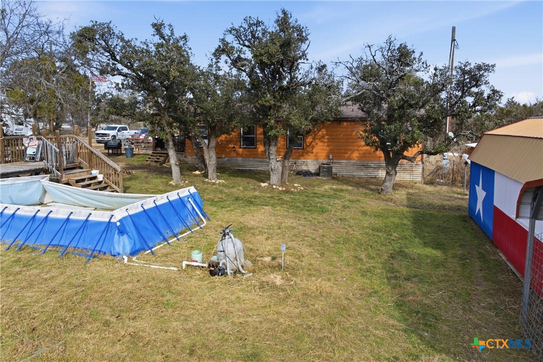 164 County Road 4450 Kempner, TX 76539 - Photo 8 of 42 a view of a backyard with swimming pool