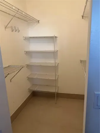a view of an empty walk in closet