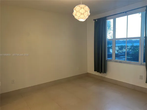 an empty room with a large window