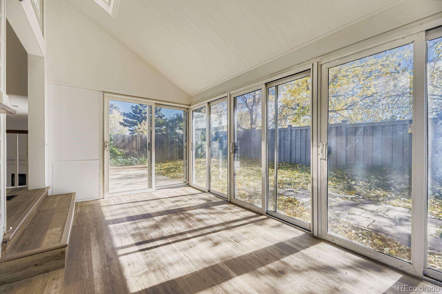 13073 South Stuart Way Parker, CO 80134 - Photo 20 of 23 a bed sitting in a bedroom next to a window