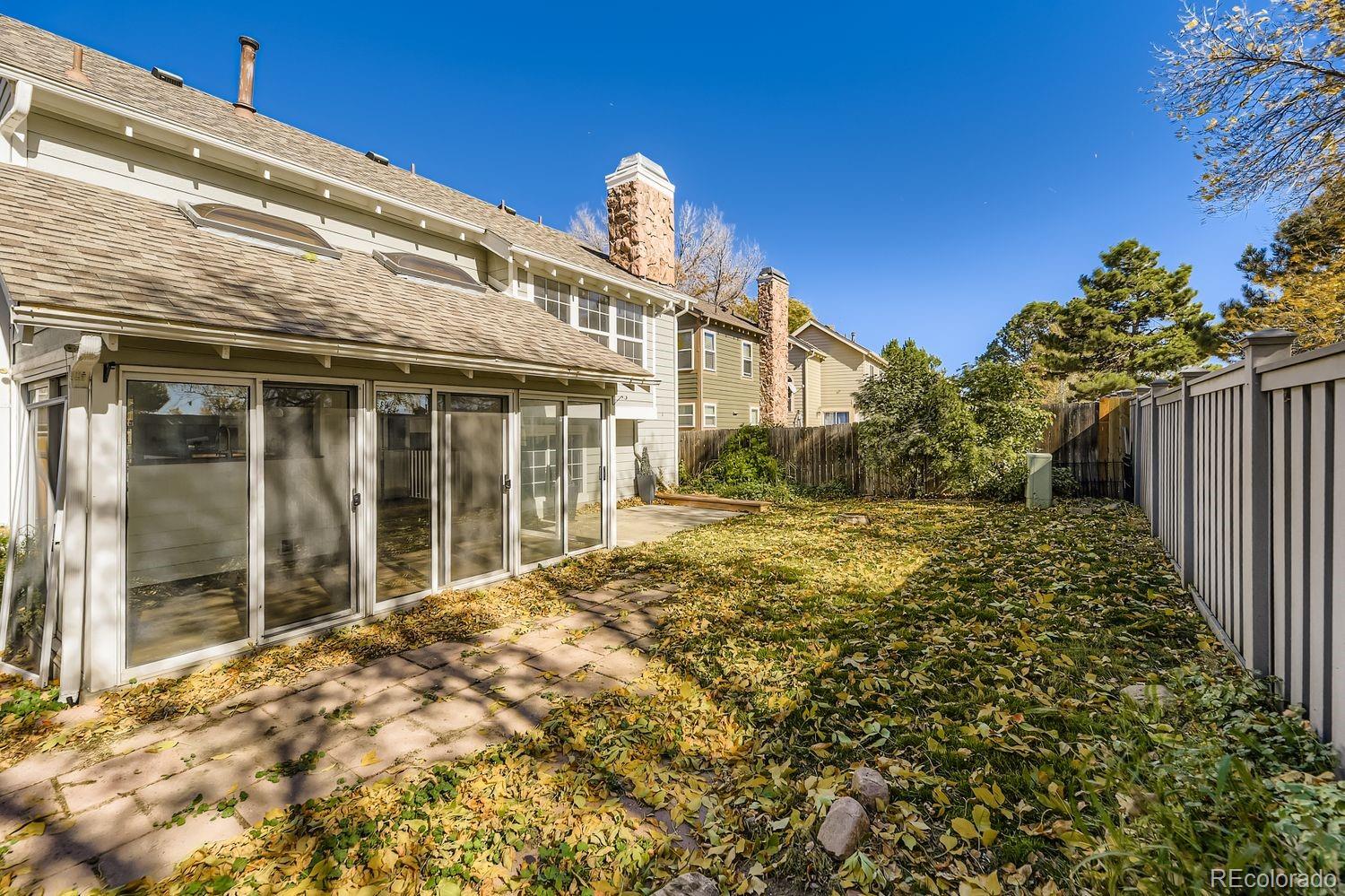 13073 South Stuart Way Parker, CO 80134 - Photo 22 of 23 a view of a house with a yard