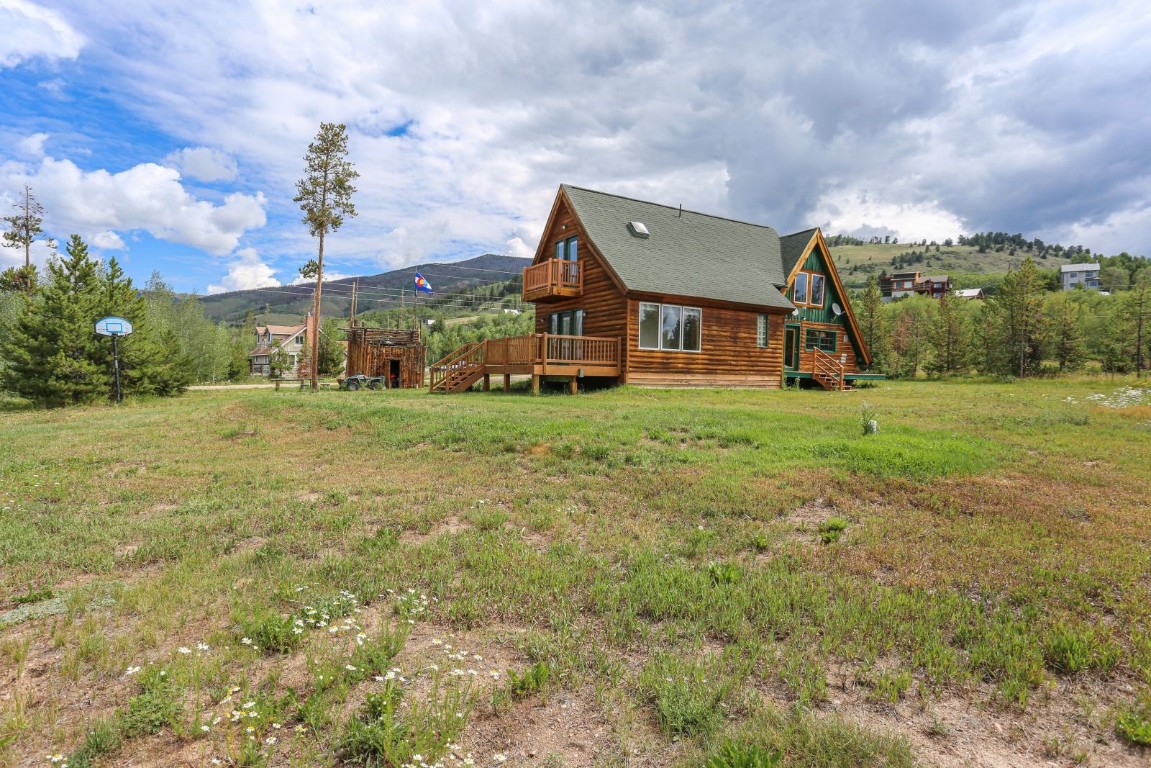 26 Raspberry Lane Silverthorne, CO 80498 - Photo 14 of 35 a view of a big house with a big yard and a large tree