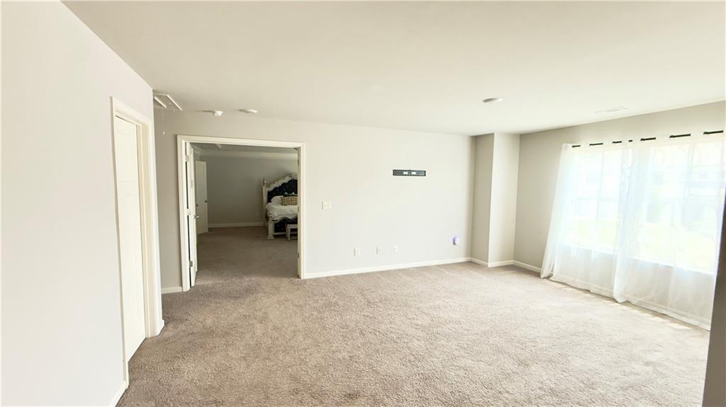 3370 Elkhorn Ridge Run Dacula, GA 30019 - Photo 14 of 29 a view of a livingroom with a staircase