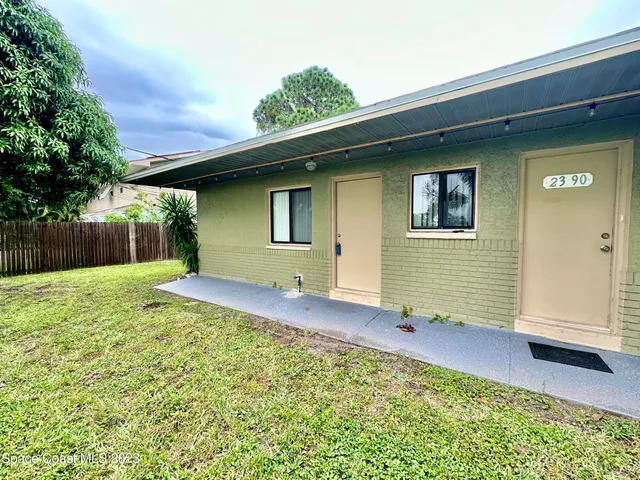 a house view with a backyard space