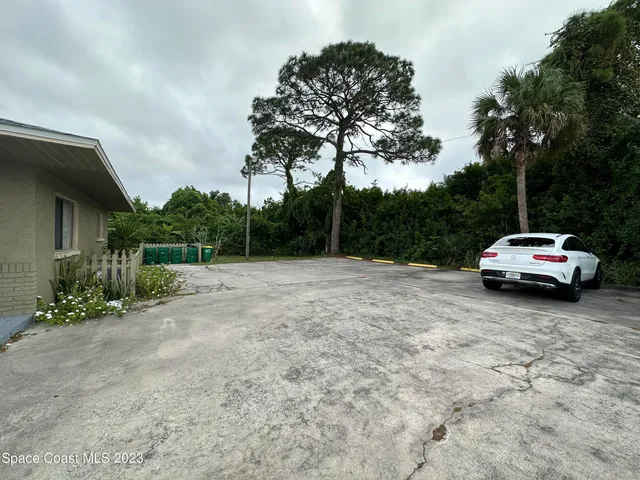 a view of a car parked on the side of the road