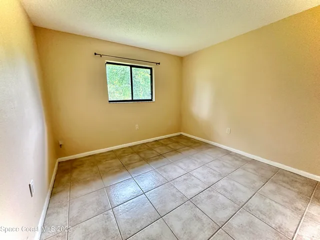 a view of a room with a window and storage