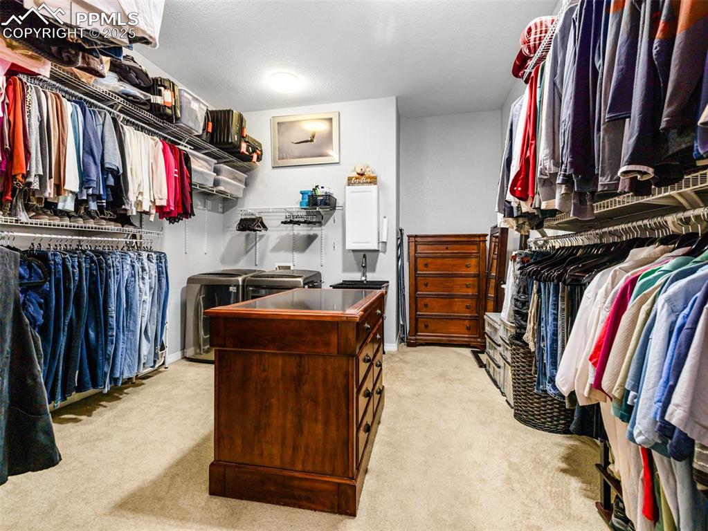 Undisclosed Address Colorado City, CO 81019 - Photo 19 of 46 a view of walk in closet with clothes and shoes