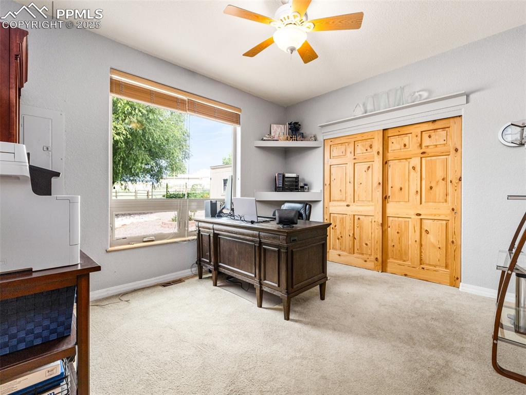 Undisclosed Address Colorado City, CO 81019 - Photo 21 of 46 a view of workspace with wooden floor and windows