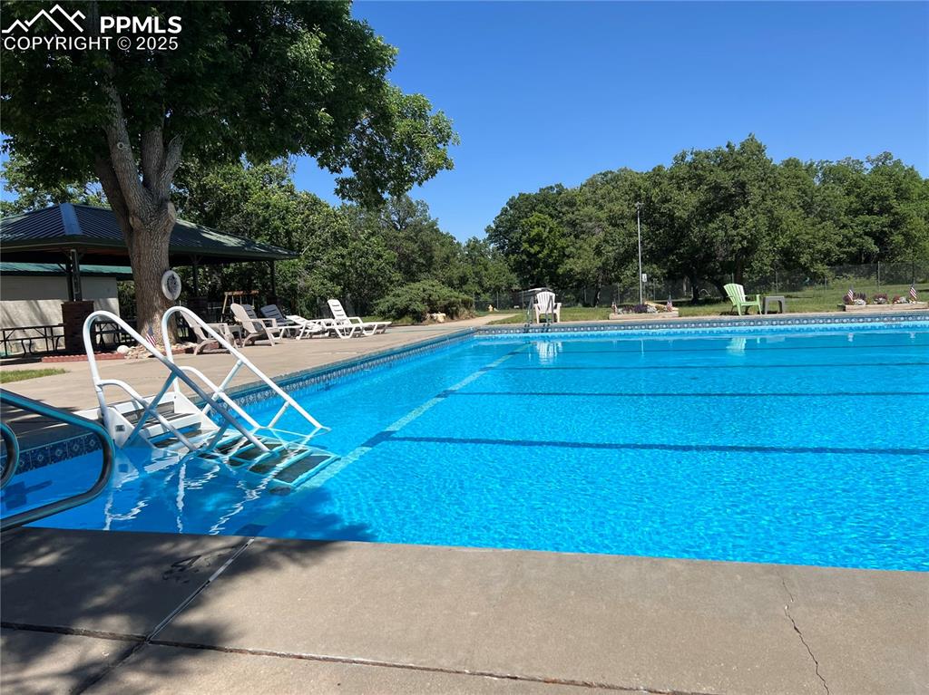 Undisclosed Address Colorado City, CO 81019 - Photo 46 of 46 a view of a tennis ground with large trees