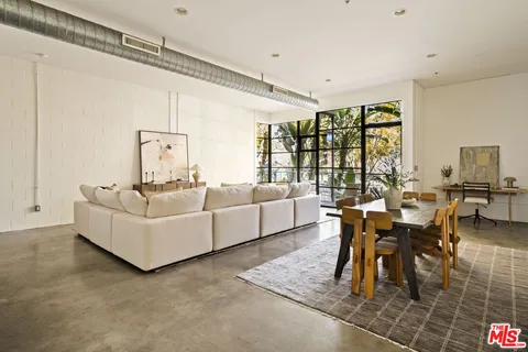 a living room with furniture and a table