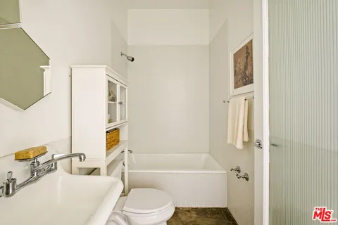 a bathroom with a toilet sink and bathtub