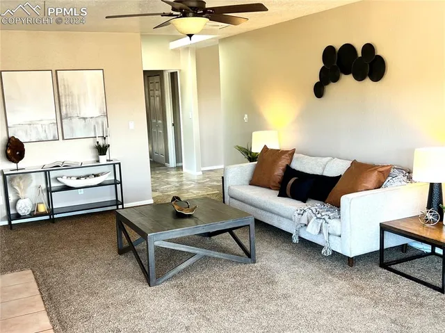 a living room with furniture and a flat screen tv