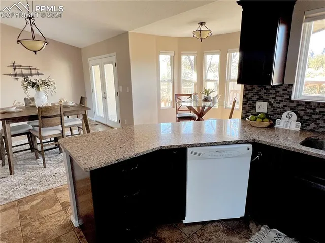 a view of a hallway with wooden shelves