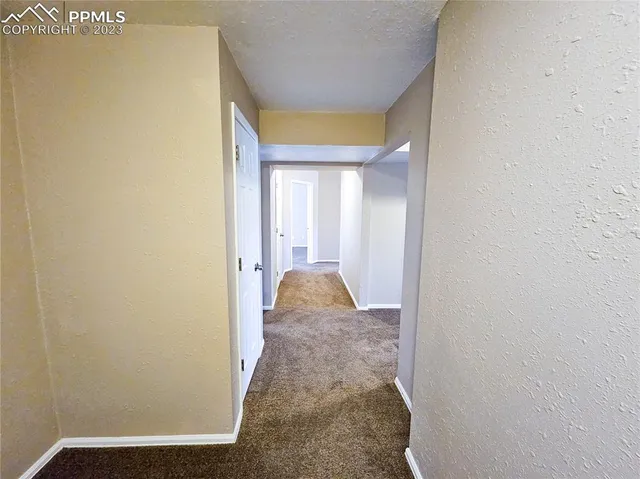view of a hallway with wooden floor