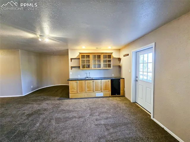 a view of a kitchen cabinets and a sink