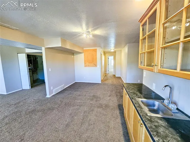 a spacious bathroom with a double vanity sink toilet and shower