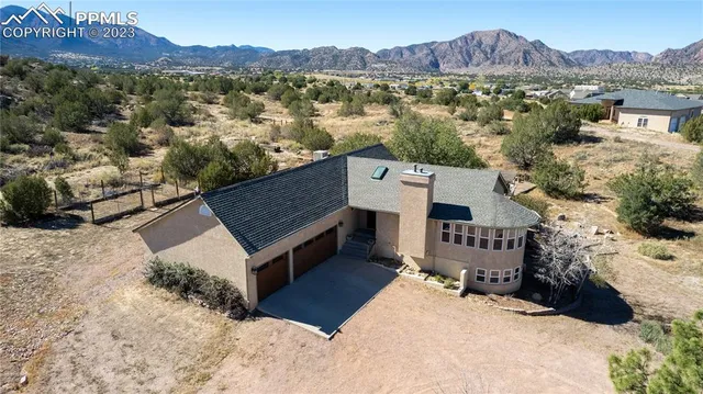 a view of a house with a mountain